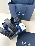 Designer belt with dark monogram strap and silver-tone square buckle
