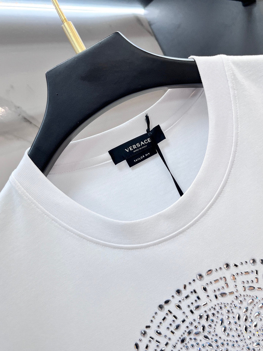 Versace white T-shirt crew neck with black size tag inside