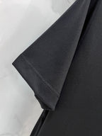 Black T-shirt sleeve and side seam hem detail