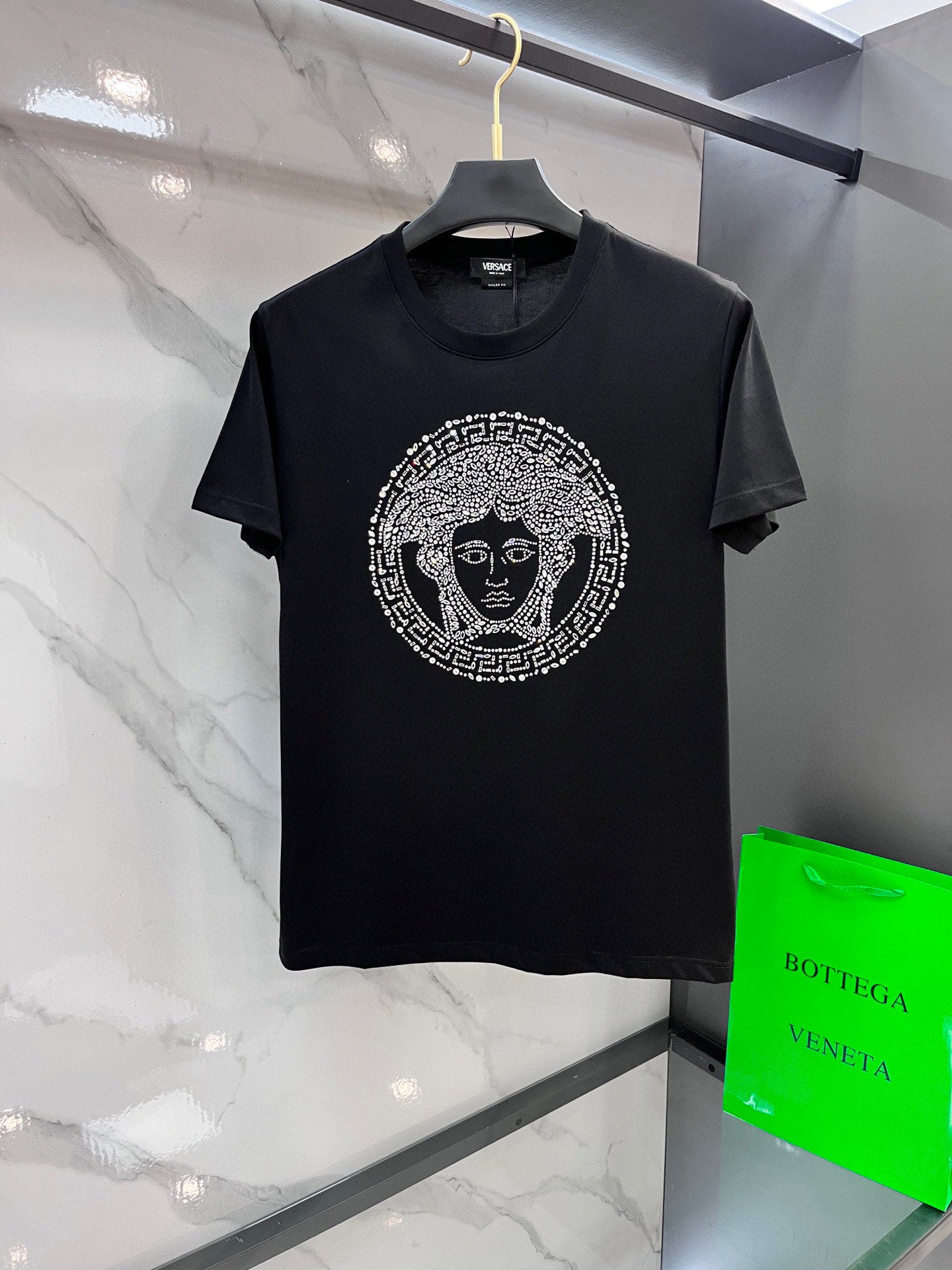 Black Versace T-shirt with silver Medusa graphic on front