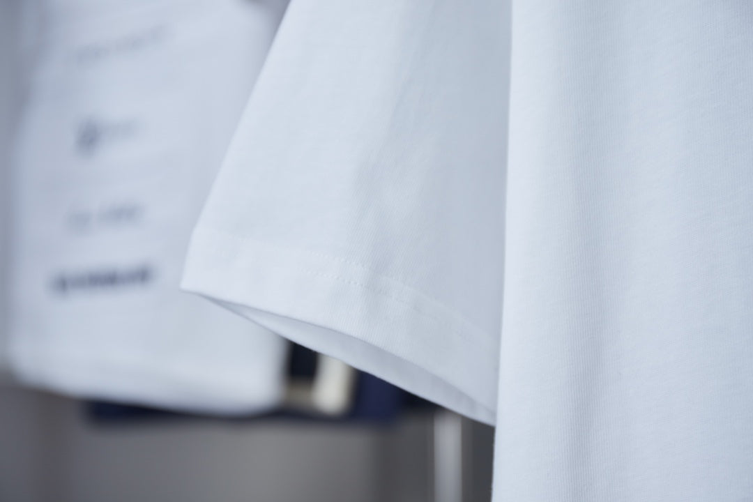 White T-shirt fabric and side hem detail on display