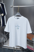 White graphic T-shirt with small chest floral emblem print