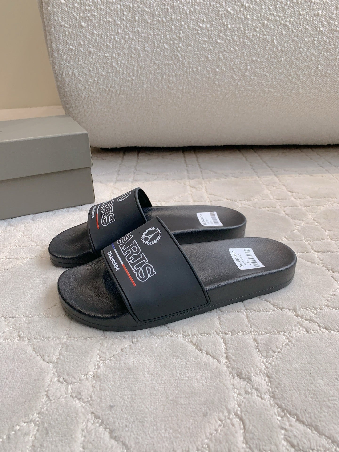 Black Balenciaga slide sandals, Paris logo strap over cushioned footbed