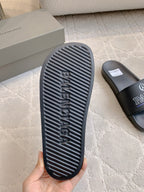 Black Balenciaga slide sandal outsole with Balenciaga word tread pattern