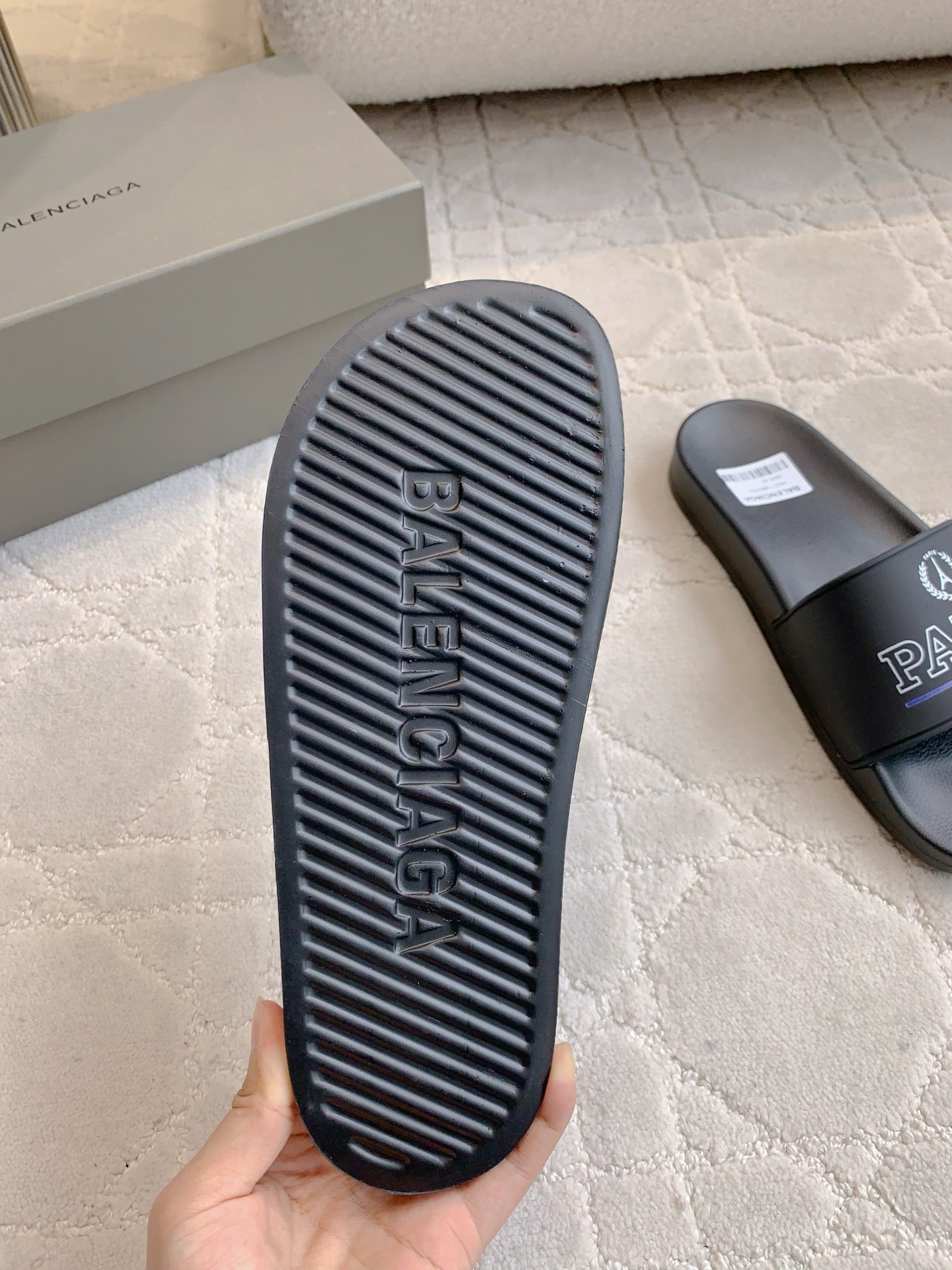 Black Balenciaga slide sandal outsole with Balenciaga word tread pattern