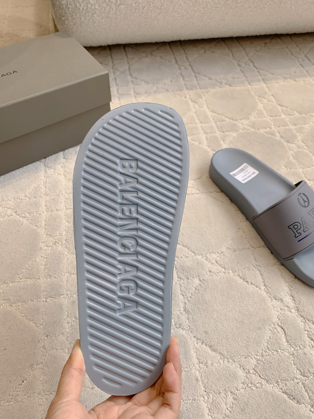 Balenciaga light blue slide sandal outsole with grippy tread pattern