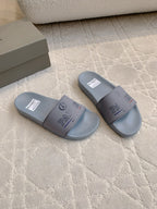 Balenciaga light blue slide sandals, two angles with PARIS logo on straps