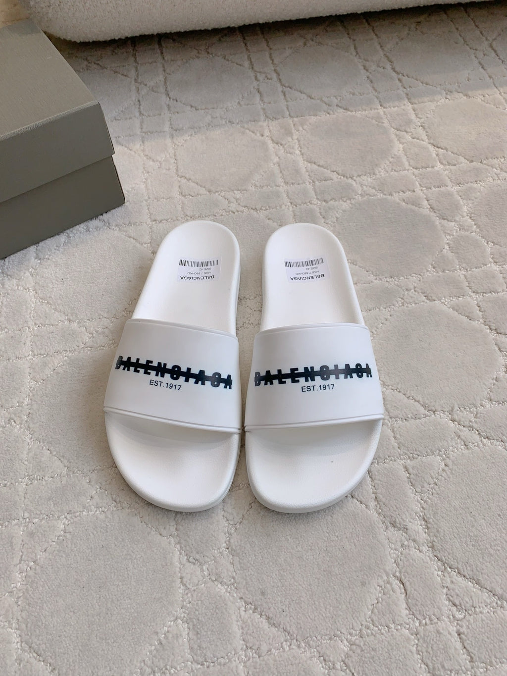 Balenciaga white slide sandals with black logo strap