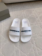 Balenciaga white slide sandals with black logo strap