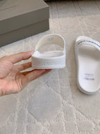 Balenciaga slide sandal with Balenciaga logo on white strap