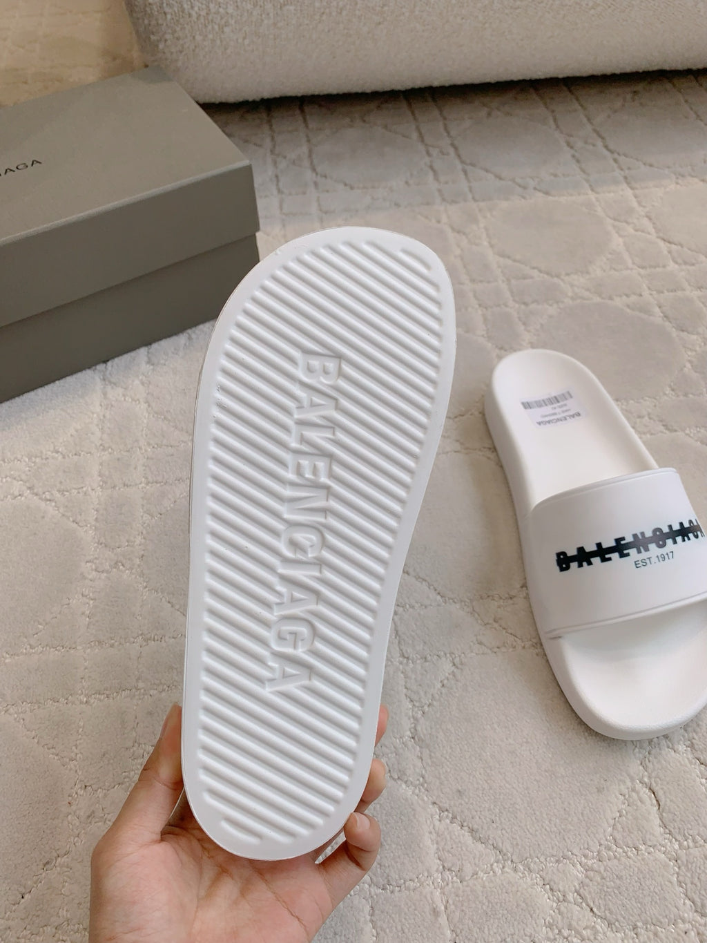 Balenciaga white slide sandal outsole with embossed lettering