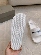 Balenciaga white slide sandal outsole with embossed lettering