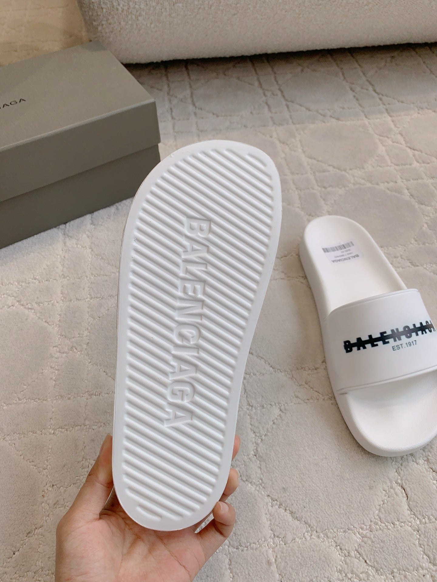 Balenciaga white slide sandal outsole with embossed lettering