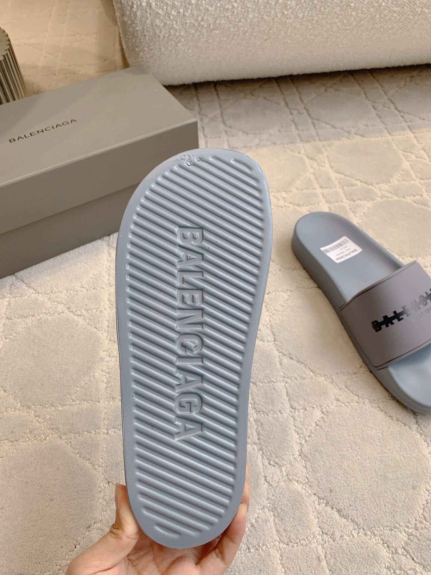 Light blue slide sandal outsole with ribbed traction tread