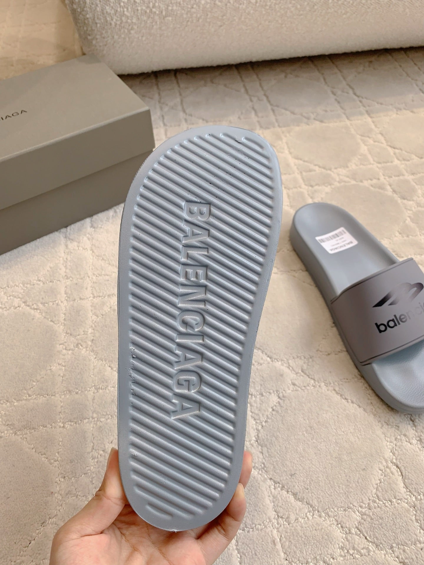 Balenciaga slide sandals outsole, light gray ribbed tread with logo