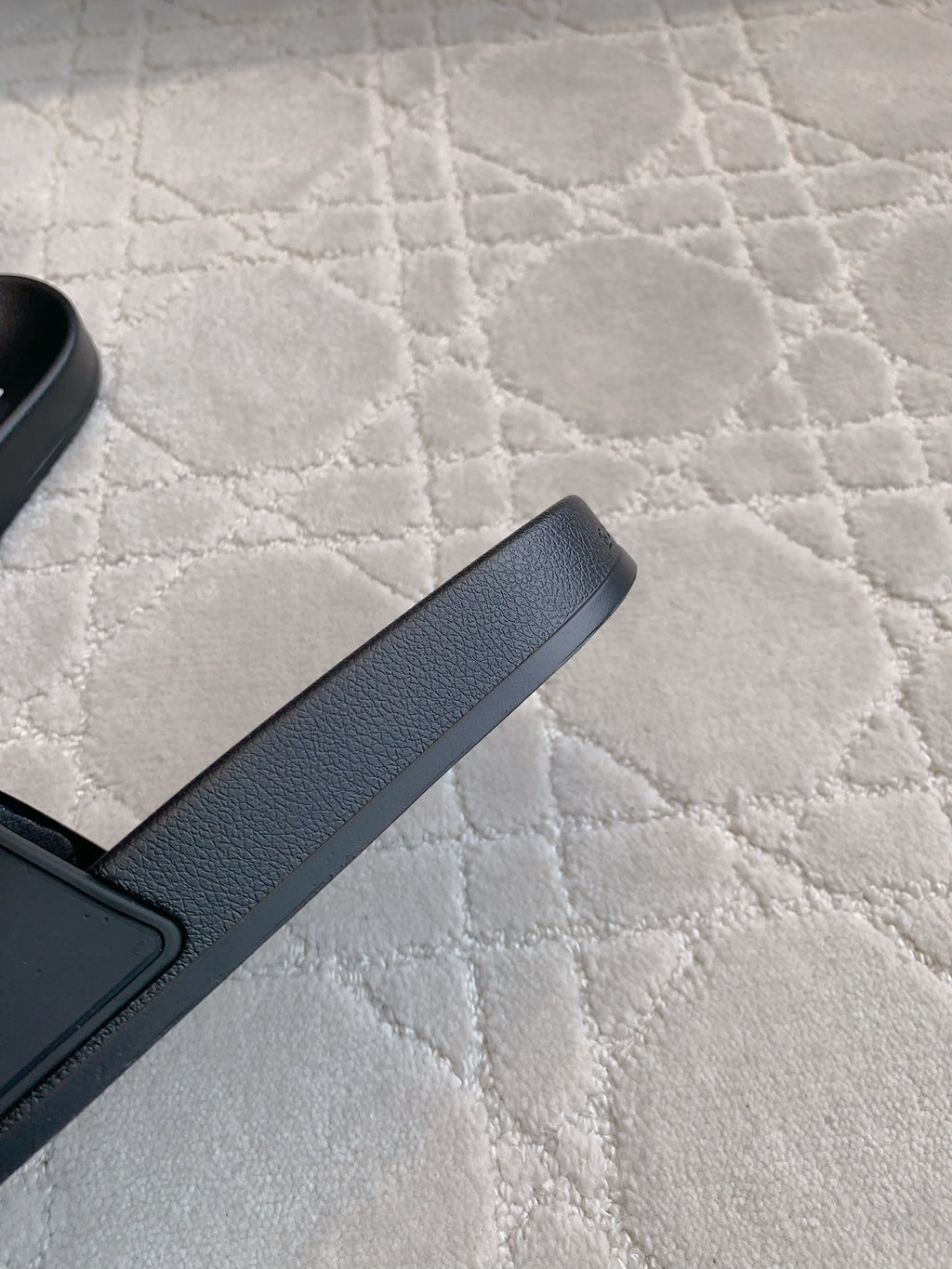 Balenciaga black slide sandal, textured strap edge and open toe profile