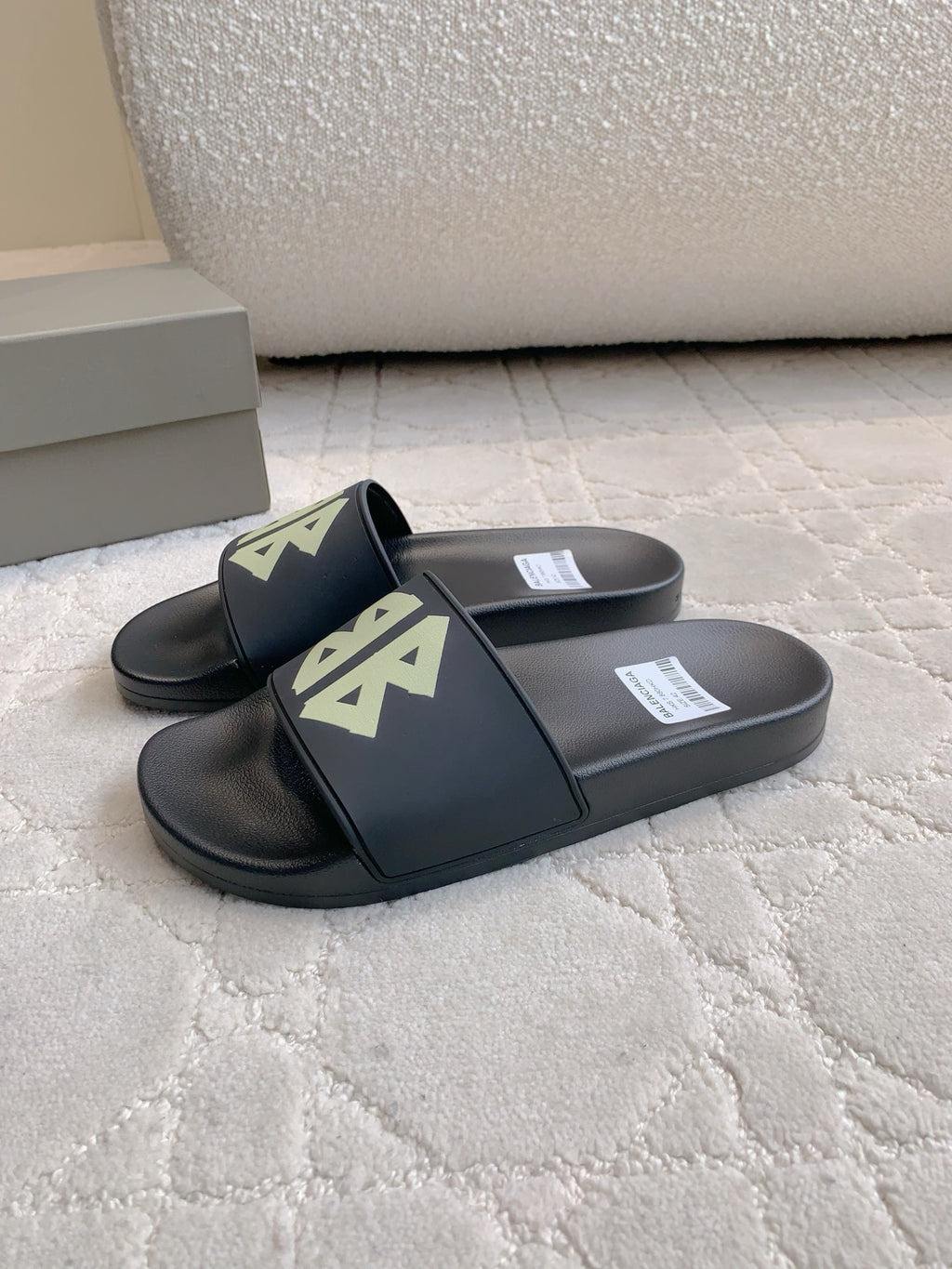 Balenciaga black slide sandals with green logo on two straps
