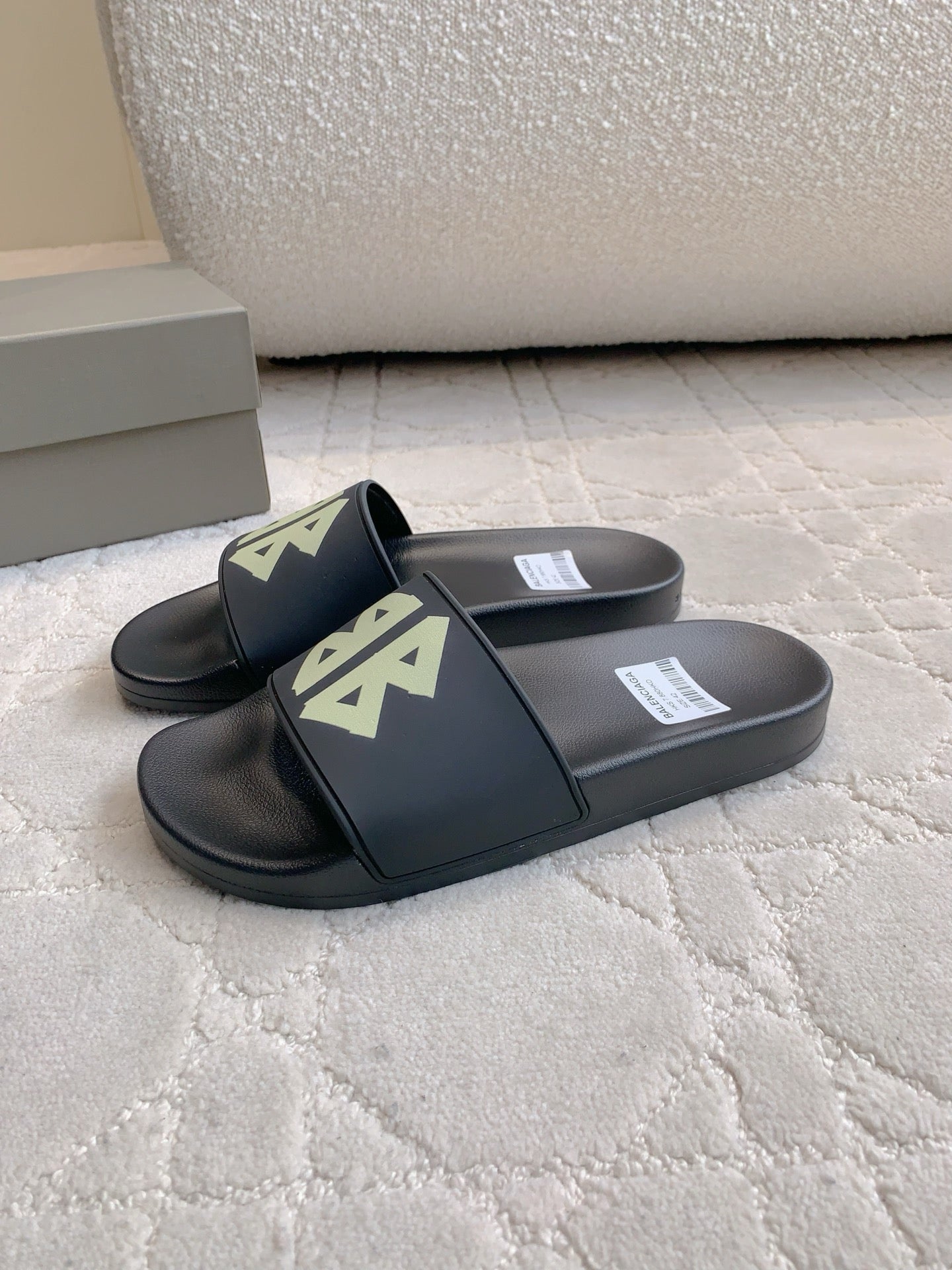 Balenciaga black slide sandals with green logo on two straps