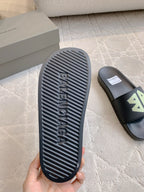 Balenciaga black slide sandal outsole with embossed Balenciaga tread