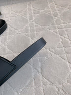 Balenciaga black slide sandal with thick strap and textured footbed