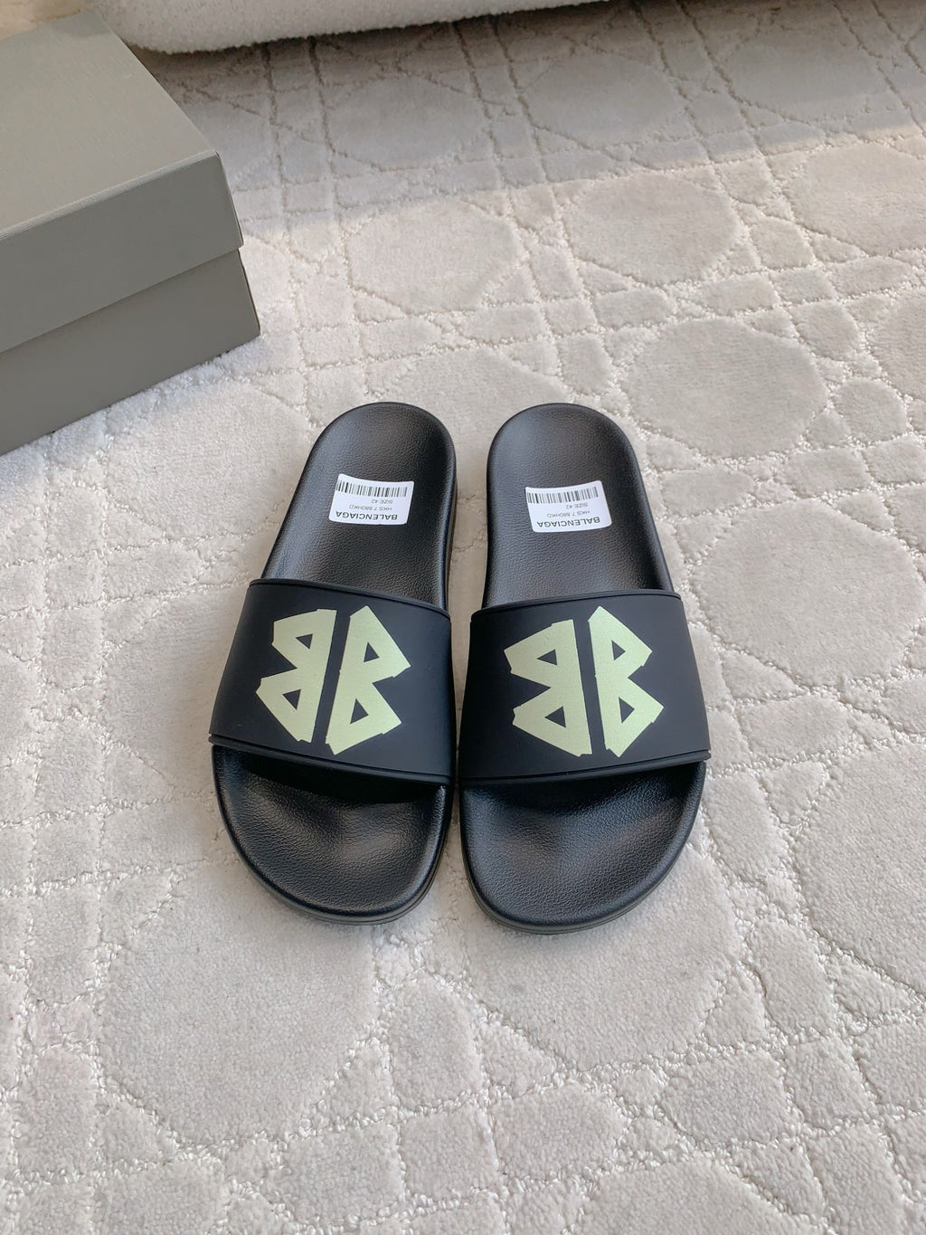 Balenciaga black slide sandals with green logo strap, cushioned footbed