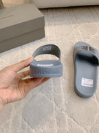 Balenciaga slide sandals, light blue heels with embossed logo on footbeds