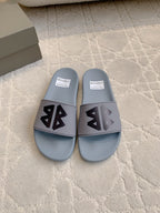 Balenciaga slide sandals, light blue with black logo on wide front strap