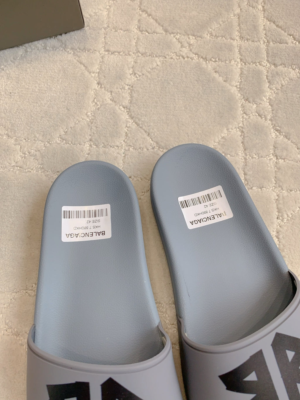 Balenciaga slide sandals, light blue clogs with white size labels on footbeds