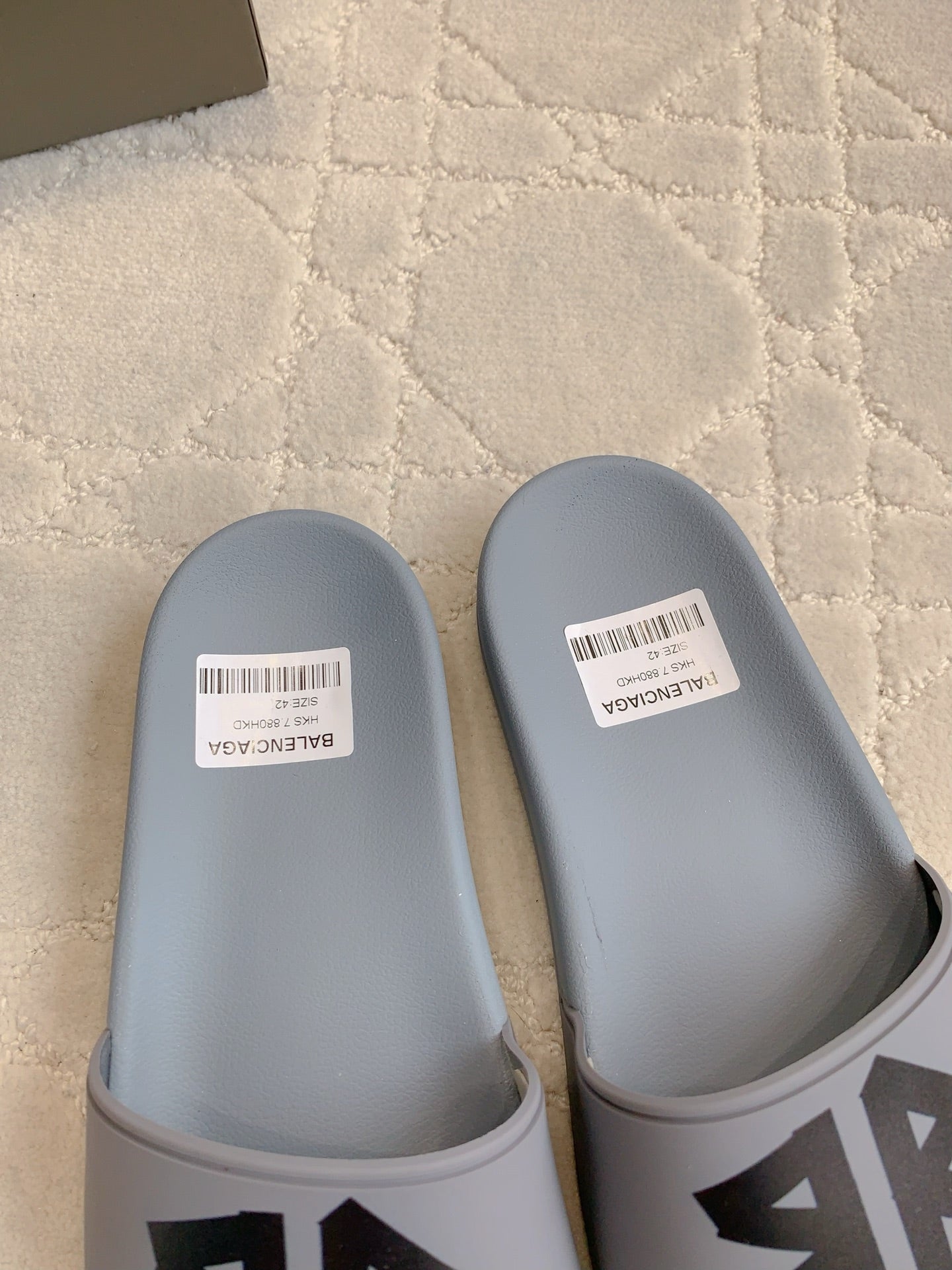 Balenciaga slide sandals, light blue clogs with white size labels on footbeds