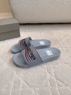 Balenciaga slide sandals, light blue-gray rubber with logo strap