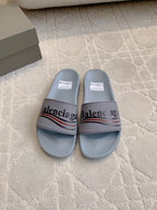 Balenciaga slide sandals in light blue-gray, with wide logo strap and footbed