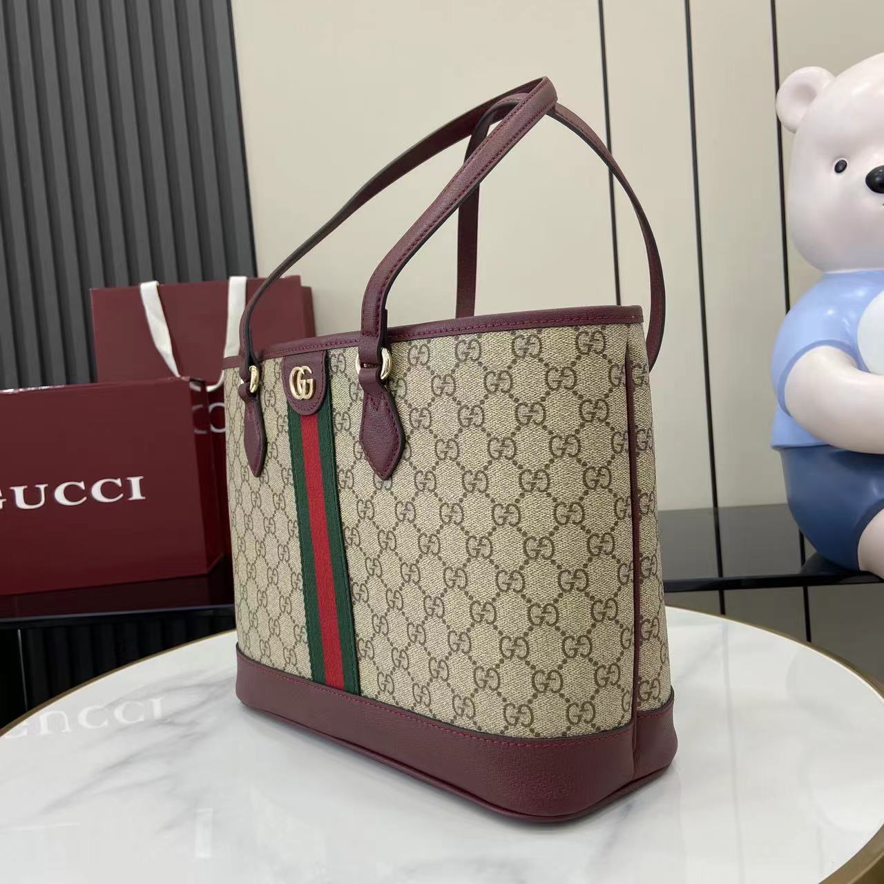 Gucci tote bag in GG canvas with burgundy handles and green-red web stripe across center