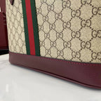 Gucci tote bag bottom edge with GG canvas, burgundy border, and stitched trim
