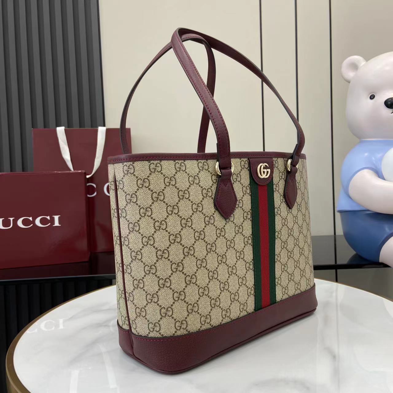 Gucci tote bag, GG canvas with burgundy leather base and handles, green-red stripe detail
