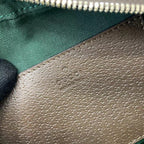 Gucci crossbody bag interior leather panel with embossed GG pattern