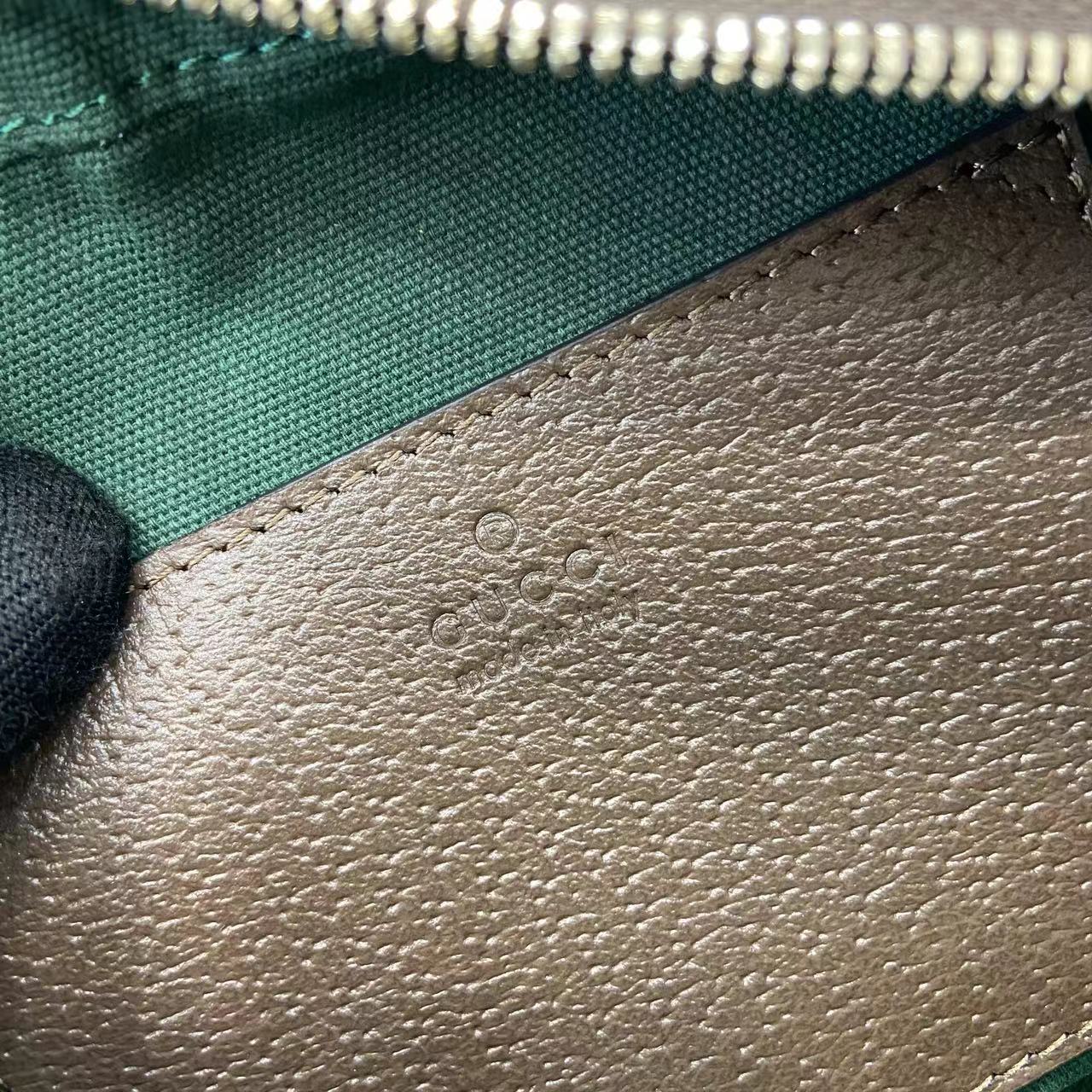Gucci crossbody bag interior leather panel with embossed GG pattern