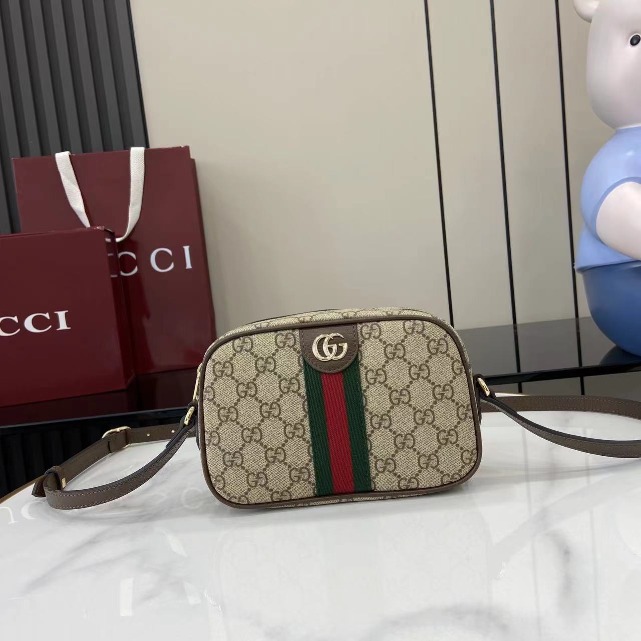 Gucci crossbody bag in beige GG canvas with green and red web stripe