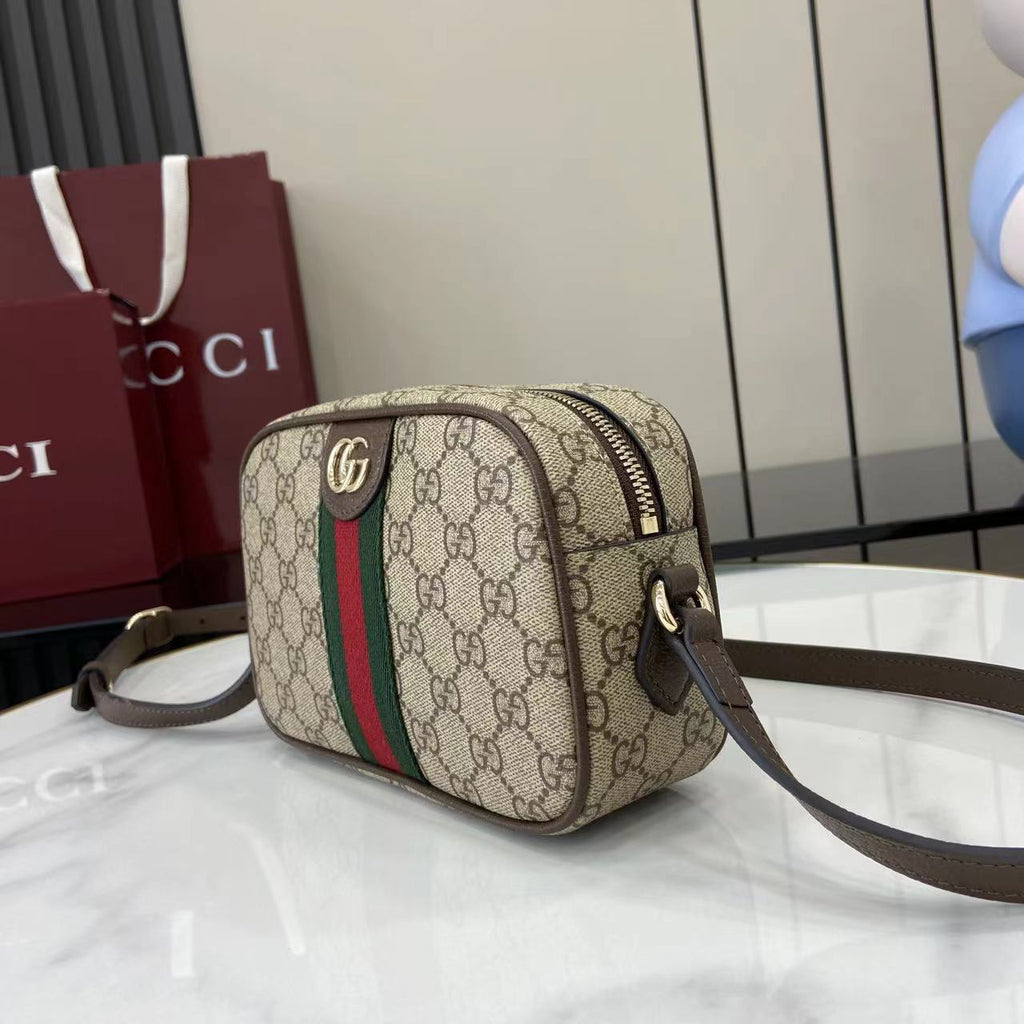 Gucci crossbody bag in beige GG canvas with green and red web stripe, top zip