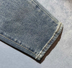 Hem of light wash denim pants with straight cuff stitching