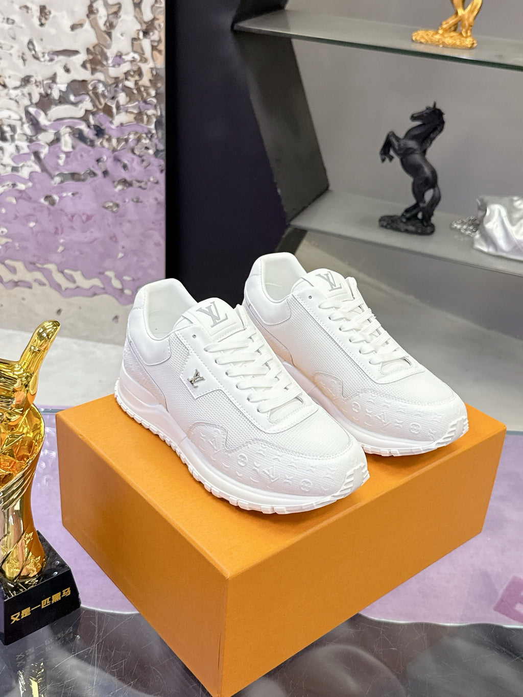 Louis Vuitton white sneakers on orange shoebox, lace-up style