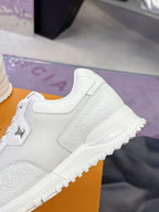 Louis Vuitton white sneaker side with LV monogram texture and lace-up