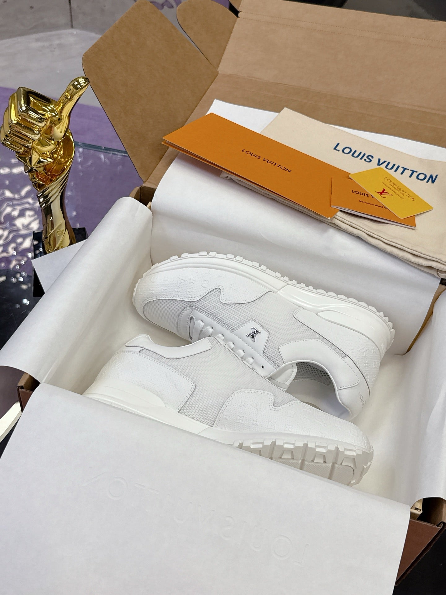 Louis Vuitton white sneakers with lace-up front, low-profile rubber sole