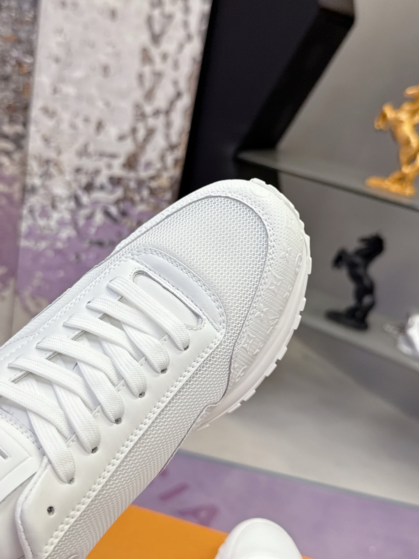 Louis Vuitton white sneaker toe and laces, textured finish
