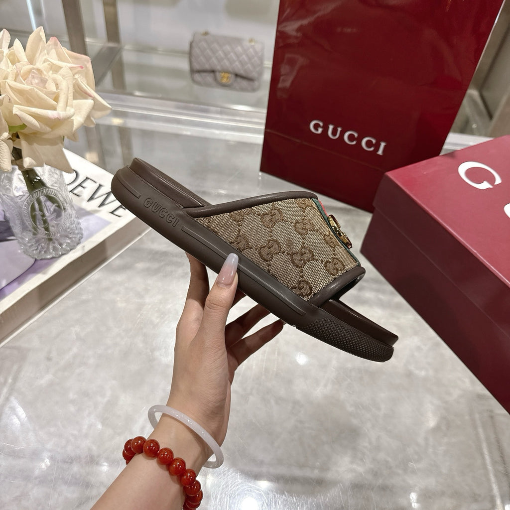 Gucci slide sandals, brown sole with GG canvas strap, green/red web stripe, gold-tone buckle