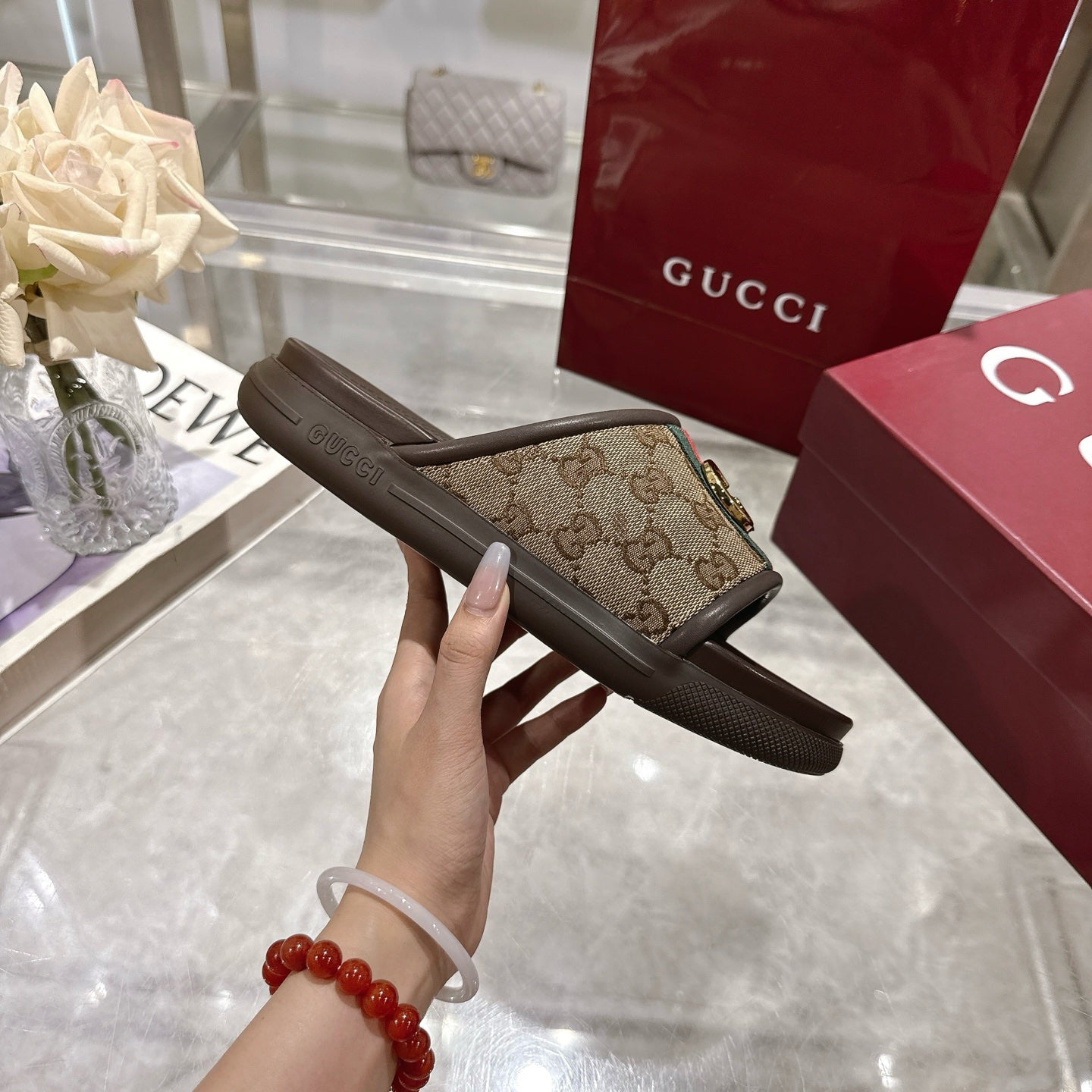 Gucci slide sandals, brown sole with GG canvas strap, green/red web stripe, gold-tone buckle