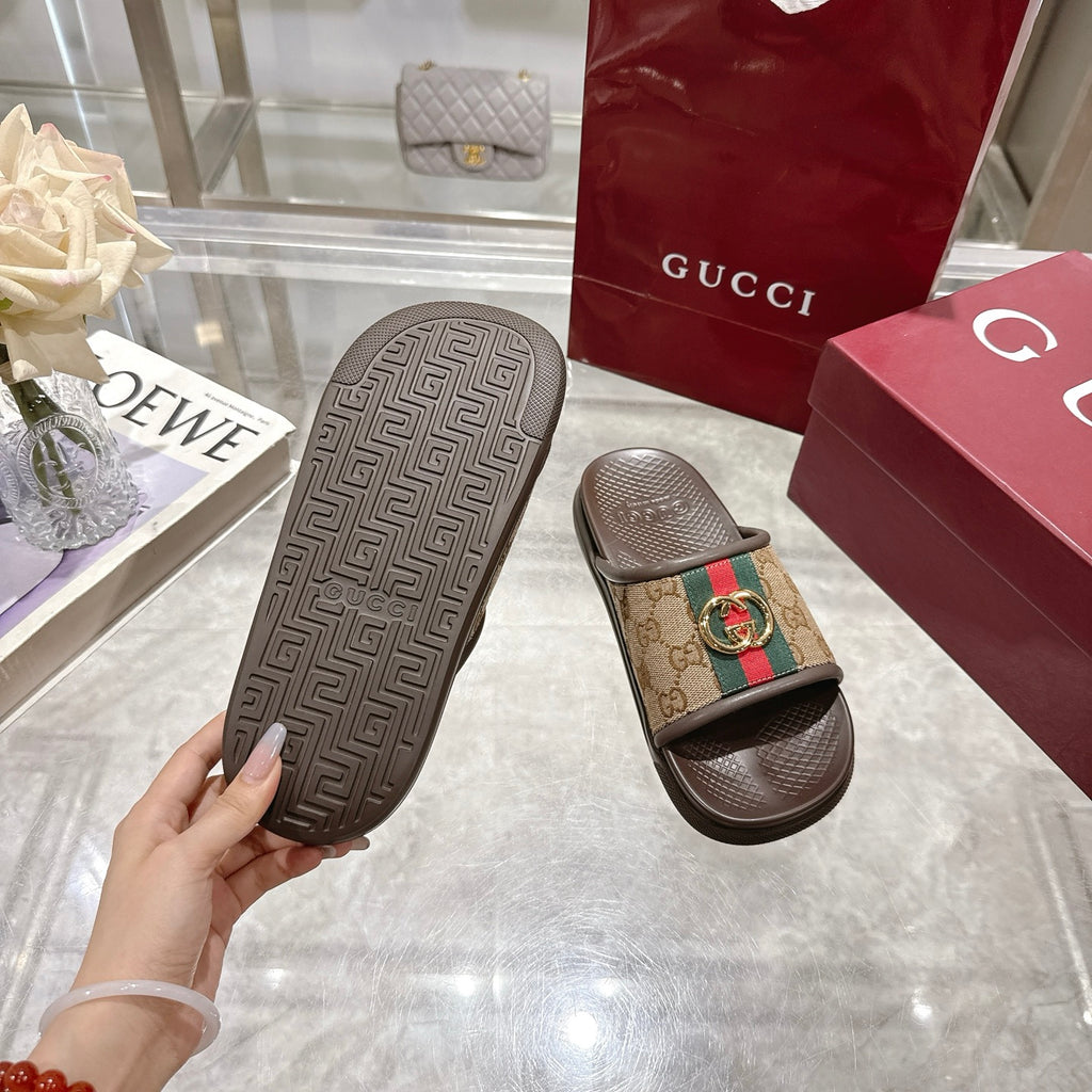 Gucci slide sandal outsole, dark brown geometric tread pattern