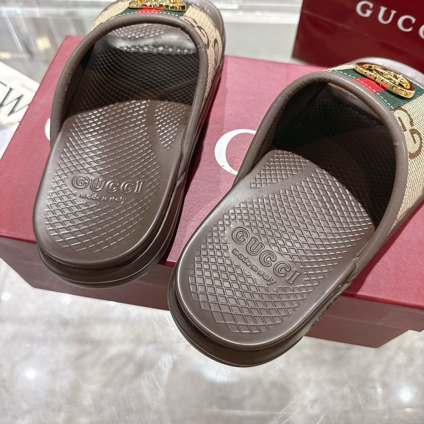 Gucci sandals footbed close-up with textured tread and embossed Gucci branding
