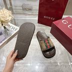 Gucci sandals soles with textured pattern and GG canvas strap with gold buckle