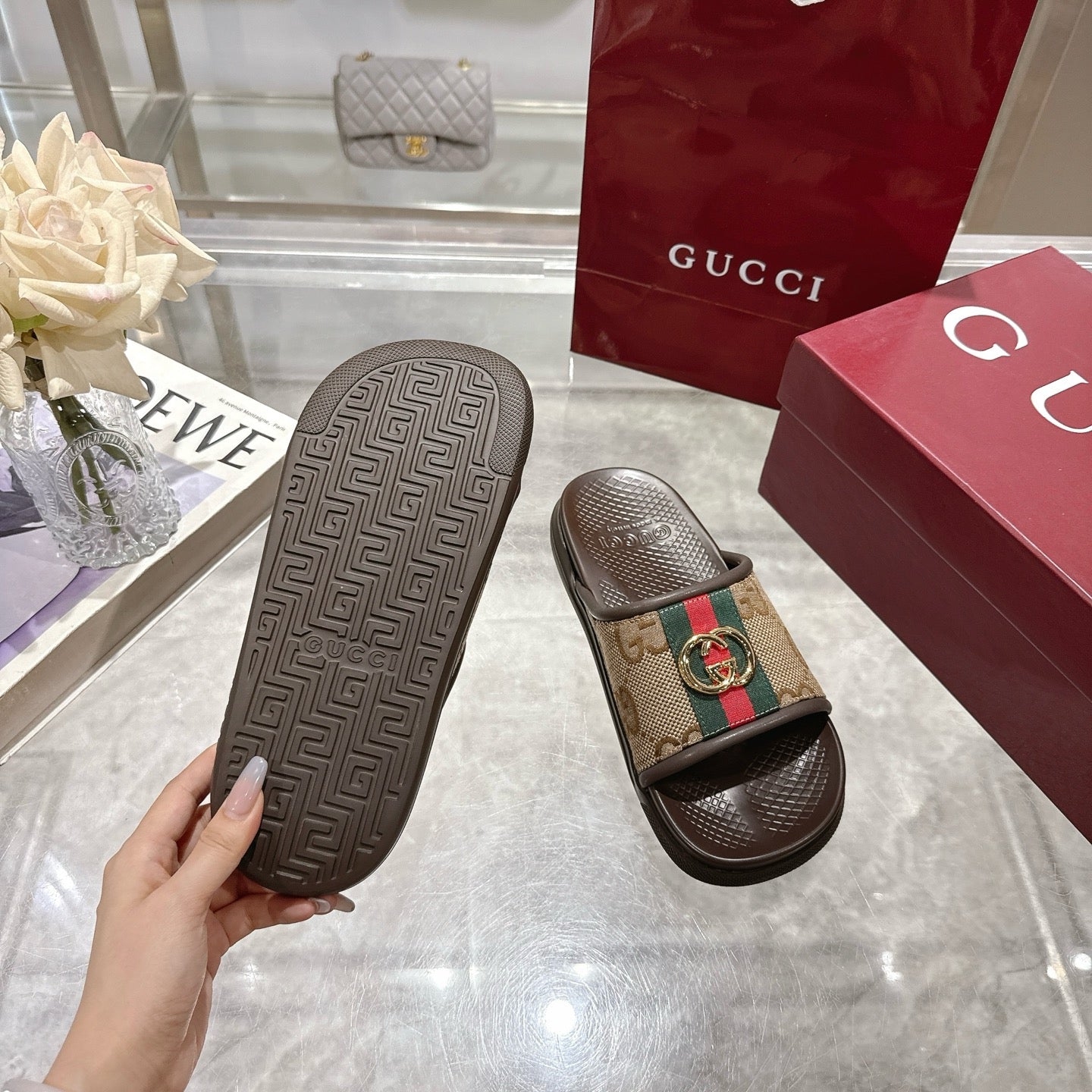 Gucci sandals soles with textured pattern and GG canvas strap with gold buckle