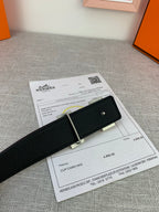 Black leather belt with silver-tone buckle and keeper on product paperwork